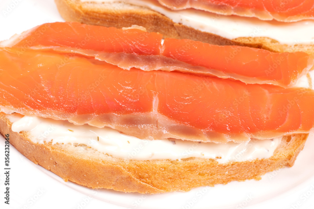 Sandwich with slices of red fish. Sliced Salmon. Food concept.