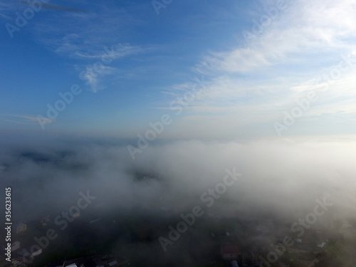 Fototapeta Naklejka Na Ścianę i Meble -  Aerial view of the morning fog (drone image). Near Kiev