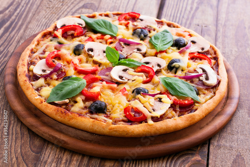 Pizza with seafood on wood table top view