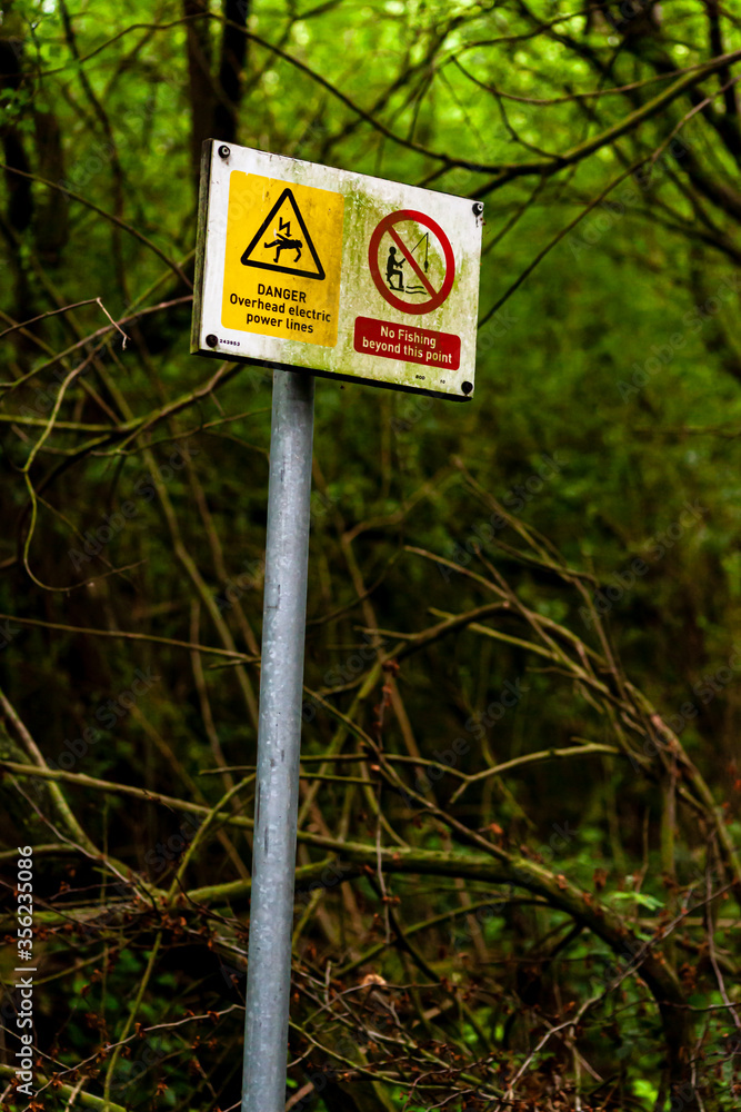 Warning signs for fishermen on Harthill reservoir, Sheffield, U.K.