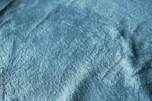 blue velvet texture from a wrinkled blanket - background wallpaper image for fragility and delicacy feeling