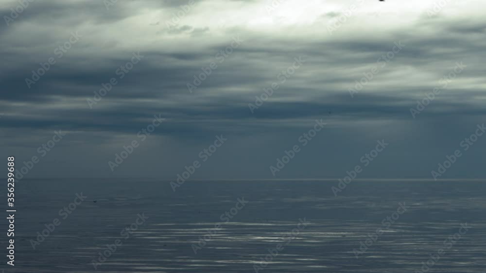 Sea coast during a storm with rain clouds Sea coast during a storm with rain clouds