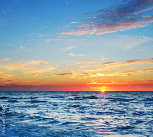 Sun setting behind the sea