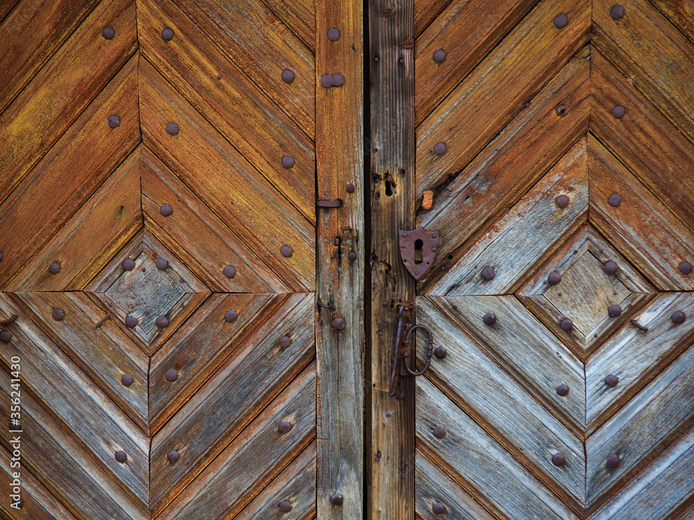 Old wooden door with rustic keyhole Old wooden door with rustic keyhole