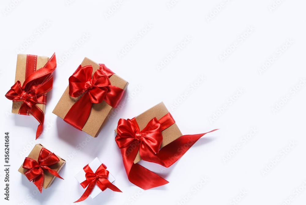 Beautiful composition of gifts with ribbons on a white background. Boxes with presents. Top view. Beautiful composition of gifts with ribbons on a white background. Boxes with presents. Top view.