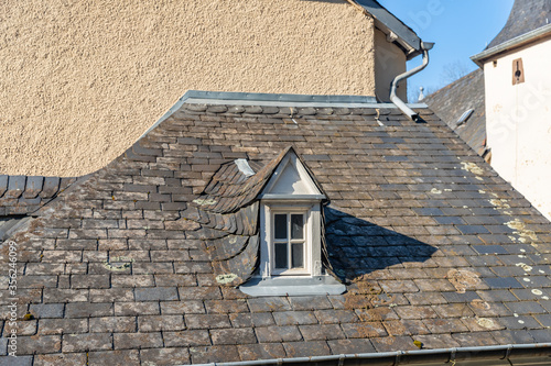 Village of Vianden ,shingled  roof of the house with window, Luxembourg