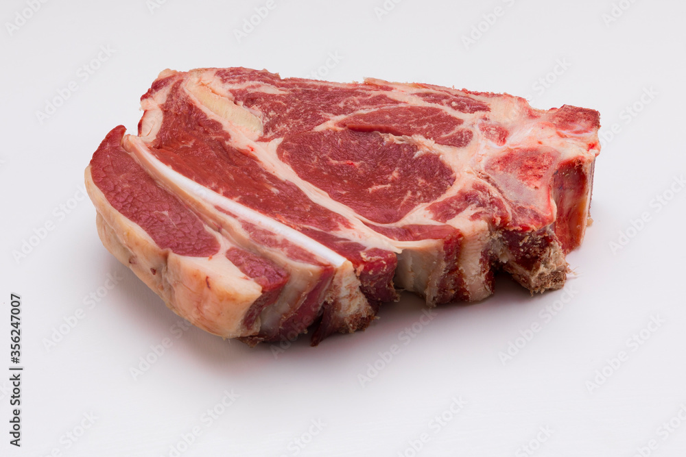 Rib steak without cooking on white background