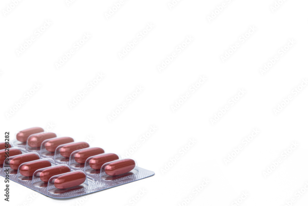 Medicine. Red medicine capsules on a white background Medicine. Red medicine capsules on a white background