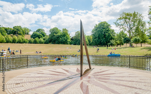 Greenwich, London, England, UK - 30 July 2015: A sundial is a device that tells the time of day when there is sunlight by the apparent position of the Sun in the sky. Greenwich Park, London,