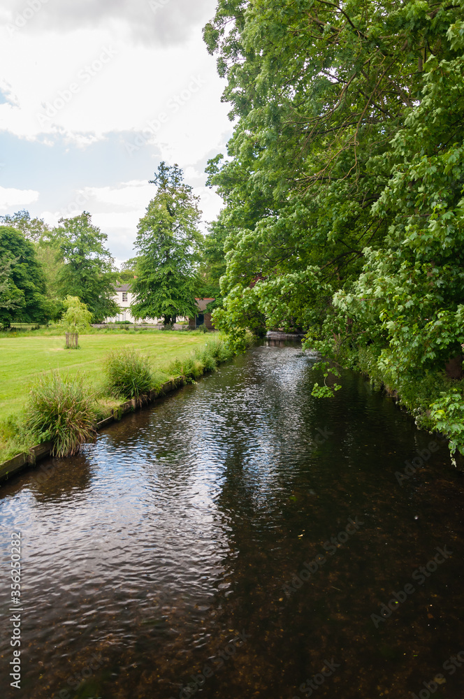Morden, London, England, United Kingdom - 9 June 2015: The River Wandle is a tributary of the River Thames running from Surrey to Wandsworth