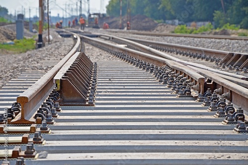 Construction of a new railway line - focus on a new rusty railhead photo