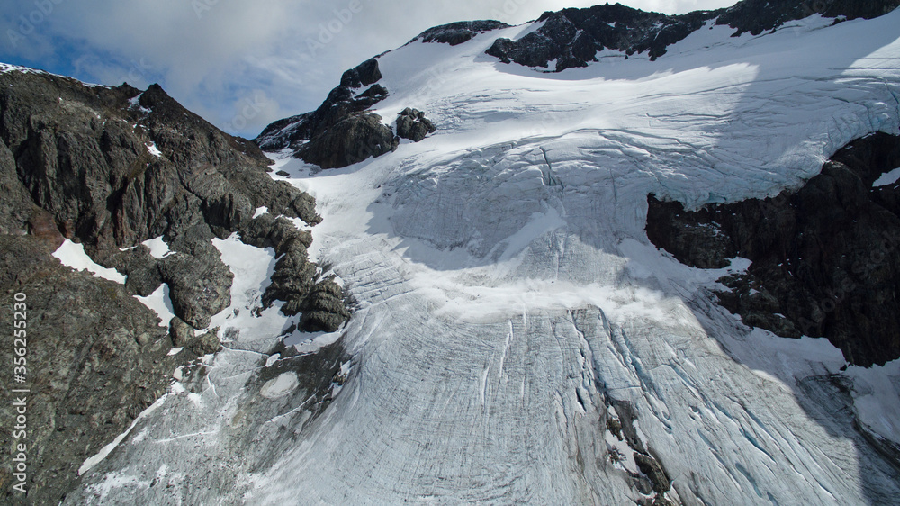 Obraz premium Aerial view of Vinciguerra Glacier in Ushuaia, Tierra del Fuego, Patagonia Argentina. Glacier ice and snow in the mountain peak.