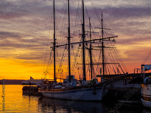 Large vintage ship. Scenic sunset, beautiful evening sky in the harbour. Oslo, Norway.