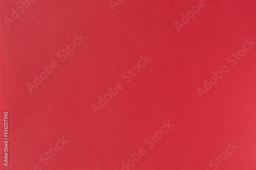 Texture of red polystyrene plastic close up, background, design with copy space