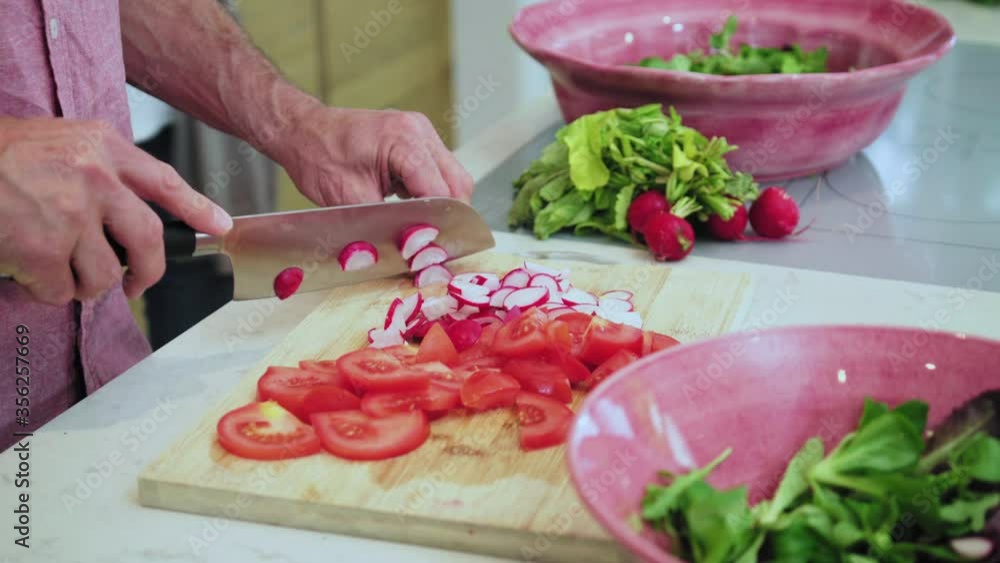 CU Mature couple preparing food in kitchen / Majorca, Spain CU Mature couple preparing food in kitchen / Majorca, Spain