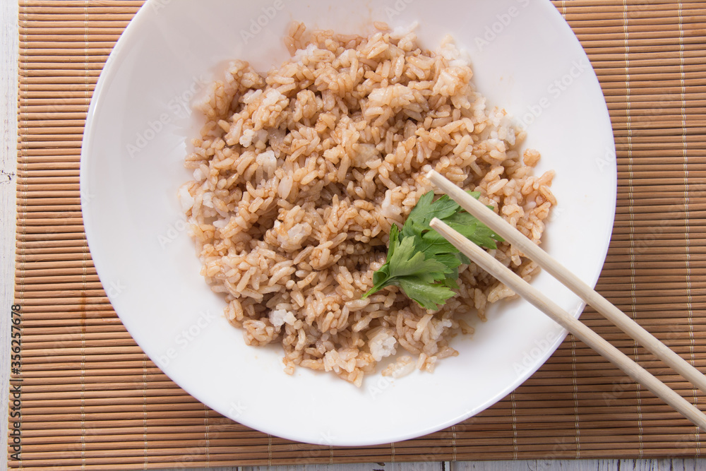 Rice with soy sauce and boiled vegetables close-up on a decorative background. Rice Dish. Fried mushrooms. Healthy eating Vegetarian food. Vegetarian dish Rice with soy sauce and boiled vegetables close-up on a decorative background. Rice Dish. Fried mushrooms. Healthy eating Vegetarian food. Vegetarian dish