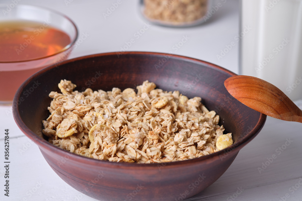 Muesli in a plate for breakfast on a white table. Muesli in a plate for breakfast on a white table.