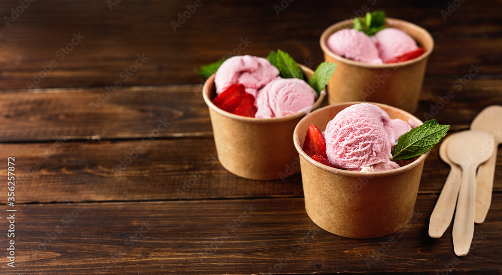 Strawberry ice cream in recycled craft paper cups Strawberry ice cream in recycled craft paper cups