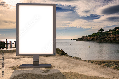 Blank advertising mockup in the street . Poster billboard on the beach background