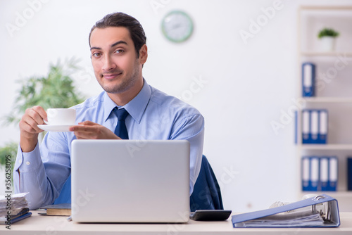 Young male employee in the office