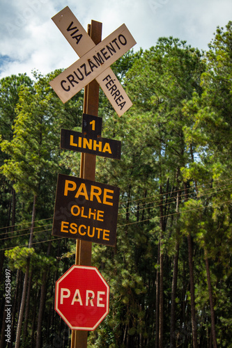 Railway line signage, dirt road crossing signage with train line