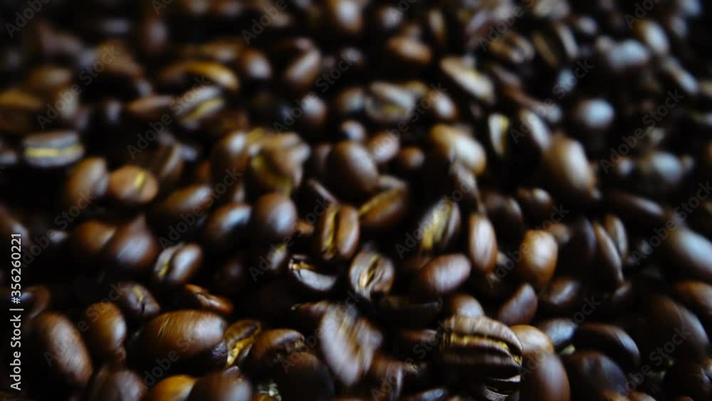 Coffee beans on the sack. Slow motion.
Coffee beans on the sack. Slow motion.