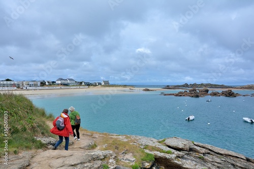 Retired hikers on the pink granite coast of Brittany in France