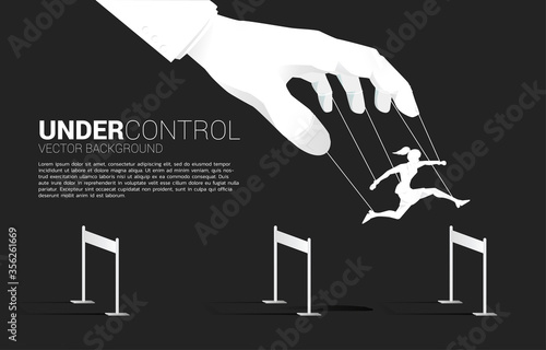 Puppet Master controlling Silhouette of businesswoman run and jumping across hurdles obstacle. Concept of manipulation and micromanagement