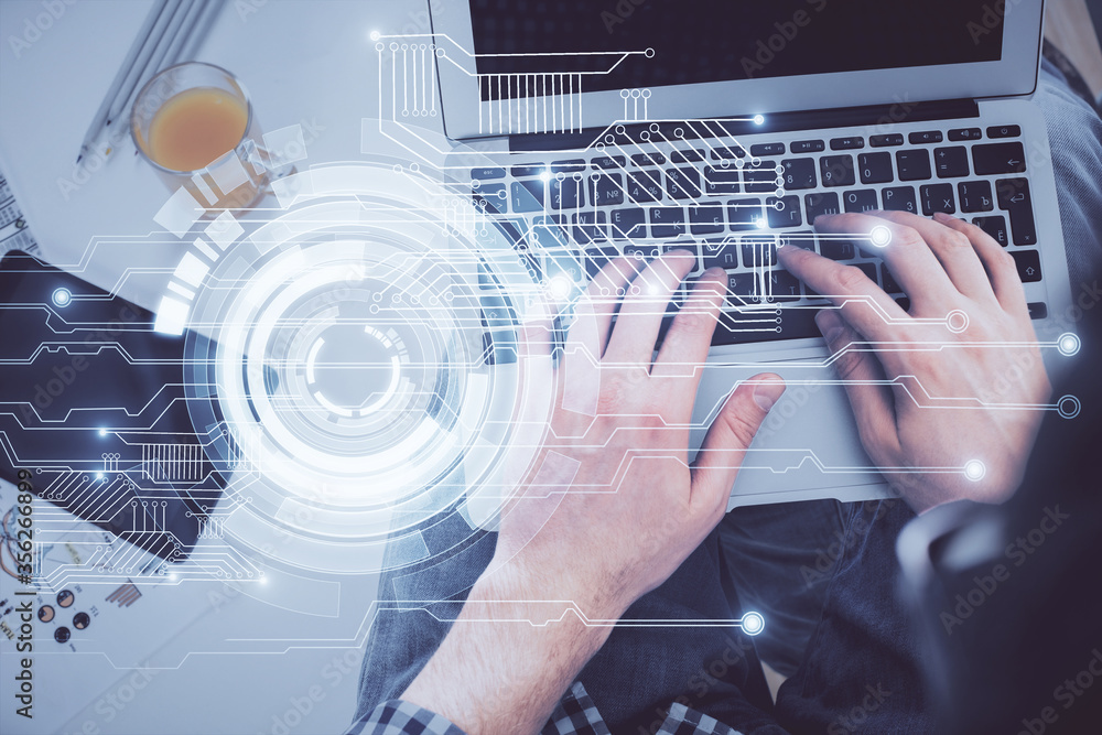 Multi exposure of man's hands typing over computer keyboard and data theme hologram drawing. Top view. Technology concept. Multi exposure of man's hands typing over computer keyboard and data theme hologram drawing. Top view. Technology concept.
