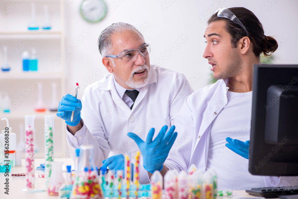 Two chemists working in the lab Two chemists working in the lab