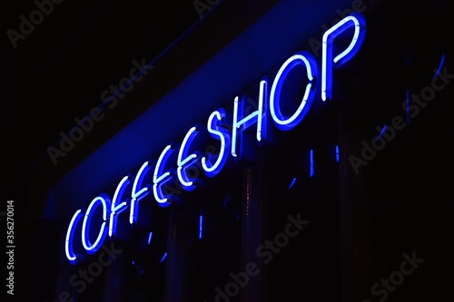 Photography A blue neon sign of a Coffeeshop (coffee shop)