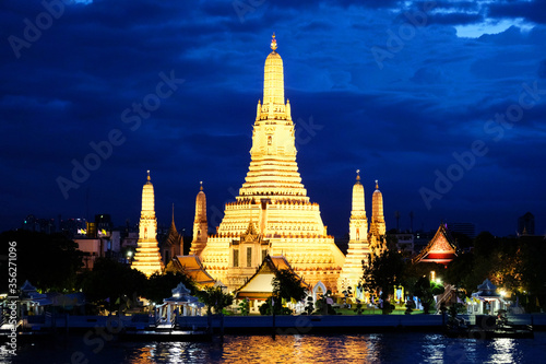 Pagodas of the Temple at Dawn in night light under deep blue sky