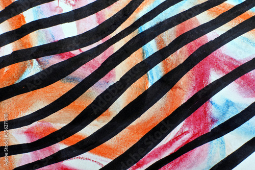 Striped fabric texture. Black waves on a multicolored background. Orange, pink, and blue spots and black lines.
