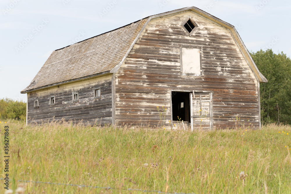 old dilapidated barn with peeling paint old dilapidated barn with peeling paint