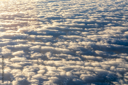 Blanket of clouds. Sun going below a blanket of clouds. On top of a blanket of clouds. Sun going below a blanket of clouds. Smooth view from above with a blanket of clouds.