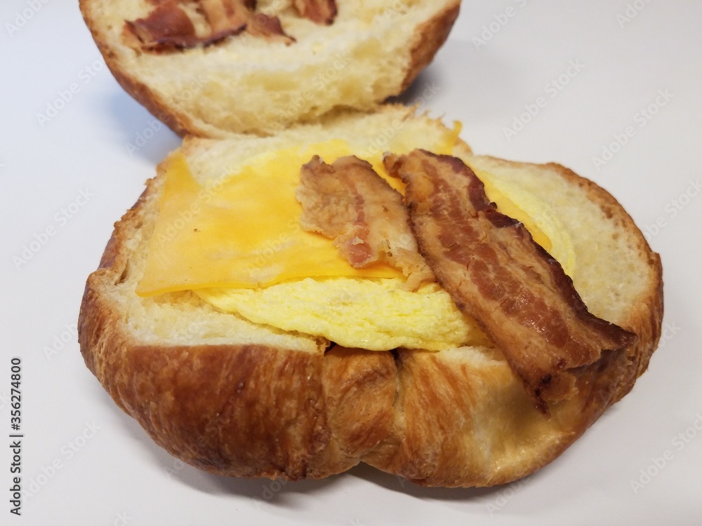 croissant with bacon and cheese and egg