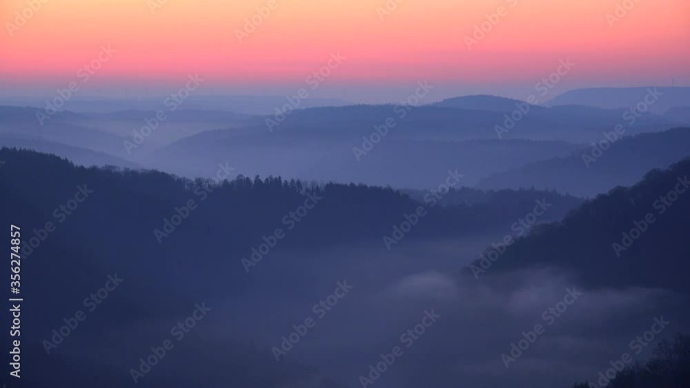 WS Aerial view of fog in mountains at twilight / Mettlach, Saar Valley, Saarland, Germany WS Aerial view of fog in mountains at twilight / Mettlach, Saar Valley, Saarland, Germany