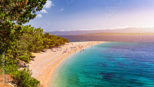 Beautiful panorama of famous Adriatic beach Zlatni Rat (Golden Cape or Golden Horn) with turquoise water , Island of Brac Croatia summertime. Famous Adriatic beach Zlatni Rat in Bol, Brac, Croatia. photo