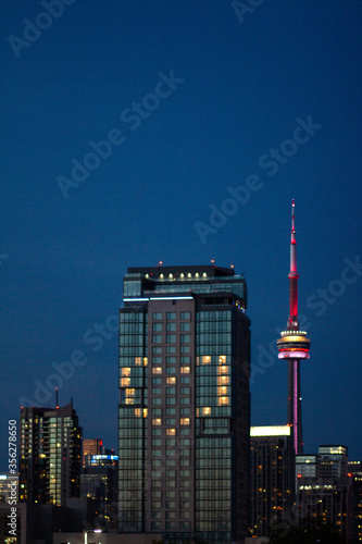 Toronto CN Tower Heart Symbol on Building Lights at Night Window