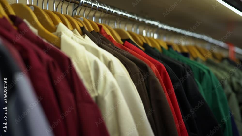 Close up of a selection of shirts on a clothes rail at Norwich market, England. Close up of a selection of shirts on a clothes rail at Norwich market, England.