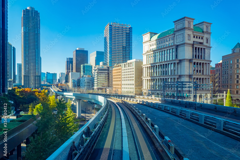 Cities of Japan. Business center of the Japanese capital. Office buildings and transport routes in Tokyo. Railway and road tracks in the center of the capital of Japan. Moving around Tokyo.