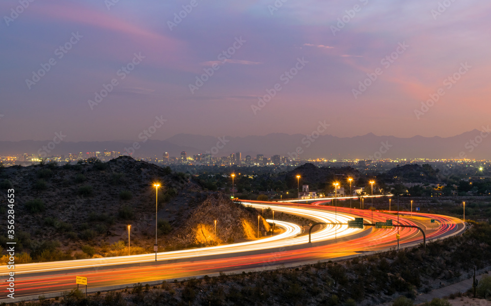 Phoenix, Arizona freeway at night with skyline
