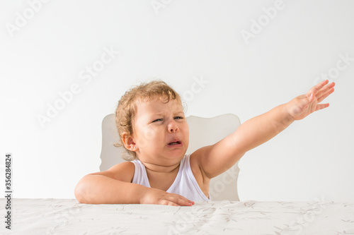 Tableau sur toile Healthy child sulking to eat