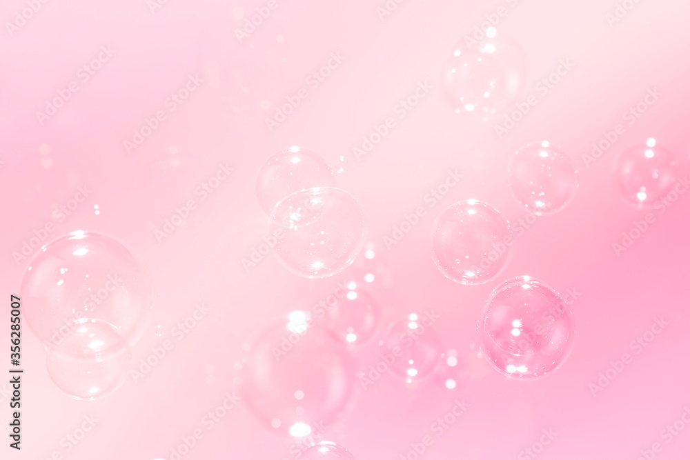 Beautiful pink soap bubbles float as background. Beautiful pink soap bubbles float as background.