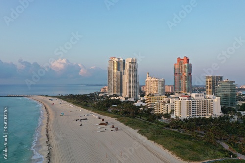 Aerial view of South Pointe Park and South Beach in Miami Beach, Florida at sunrise with Port Miami and City of Miami skyline in background. © Francisco