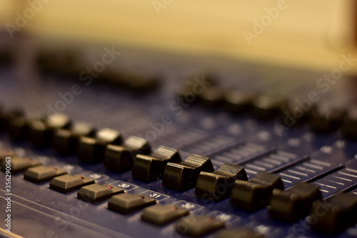 Wallpaper Mural Closeup Analog sound mixer with selected focus. Professional audio mixing console broadcasting. Torontodigital.ca