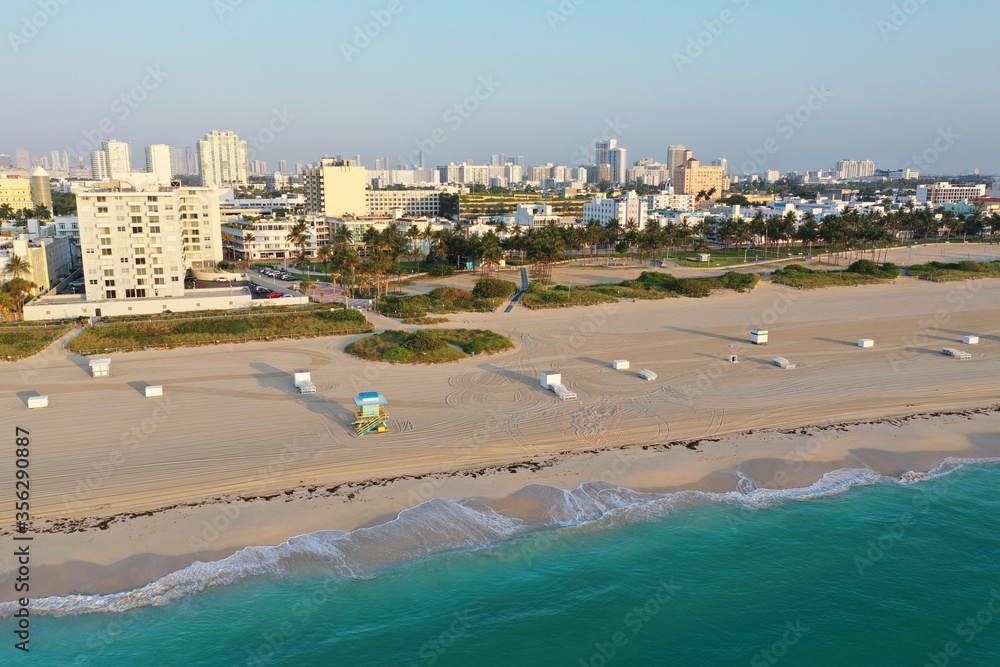 Aerial view of South Beach and Lummus Park in Miami Beach, Florida duing coronavirus beach, hotel, park and restaurant closures at sunrise.