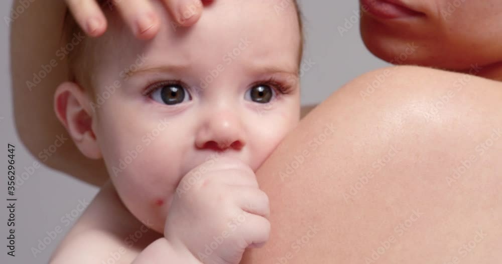 SLO MO CU Young mother kissing and stroking baby son (6-11 months) SLO MO CU Young mother kissing and stroking baby son (6-11 months)