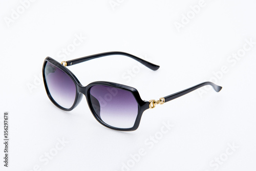 Fashion sunglasses black frames on white background.