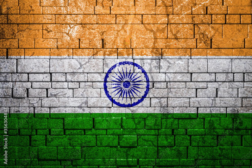National flag of India on brick  wall background.The concept of national pride and symbol of the country. Flag  banner on  stone texture background.